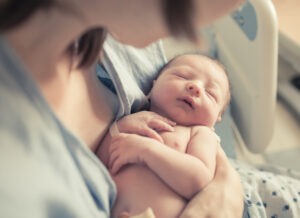 New,born,baby,boy,resting,in,mothers,arms